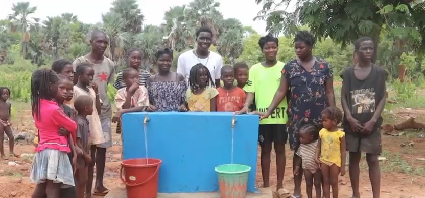 Children and families at a new water point